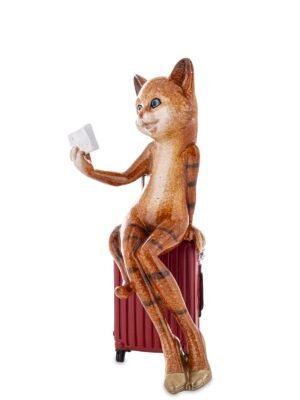 Figurka kota w podróży