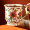 Elegancki porcelanowy kubek ze złotym wykończeniem i kwiatowym wzorem 350ml